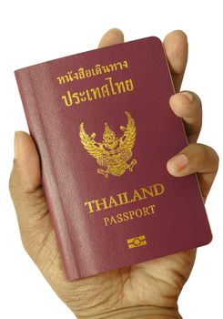 Hand holding Thailand passport isolated on white background