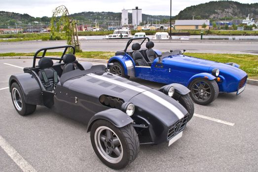 The Caterham 7 (or Caterham Seven) is a super-lightweight sports car produced by Caterham Cars in the United Kingdom. It is based on the Lotus Seven, a lightweight sports car sold in kit and factory-built form by Lotus Cars, from the late 1950s to the early 1970s. The Caterham 7 is a small, lightweight, two-seater sports car renowned for its performance and handling.  Image is shot in Halden city.