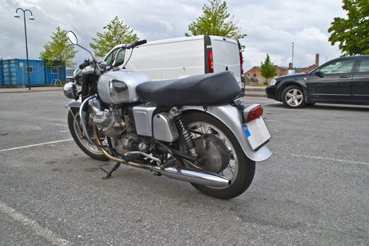 1967 Moto Guzzi V7 700. The first Italian maxi motorcycle, with its original 700cc 90° V twin engine designed by Giulio Cesare Carcano. Developed to replace the Falcone, it rose to fame with the 750 Special version and became a motorcycling legend with the highly sought after V7 Sport. Image is shot by Tista center in Halden city.
