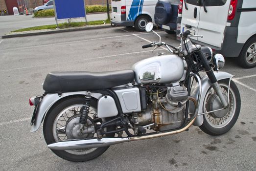1967 Moto Guzzi V7 700. The first Italian maxi motorcycle, with its original 700cc 90° V twin engine designed by Giulio Cesare Carcano. Developed to replace the Falcone, it rose to fame with the 750 Special version and became a motorcycling legend with the highly sought after V7 Sport. Image is shot by Tista center in Halden city.
