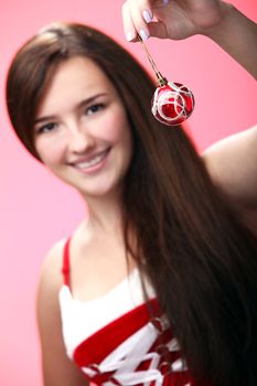 Portrait of smiling girl in red with Christmas decoration