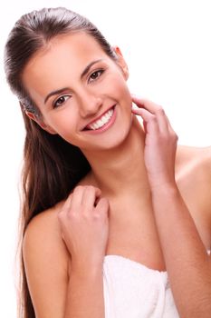 Portrait of beautiful smiling woman with cute smile in towel