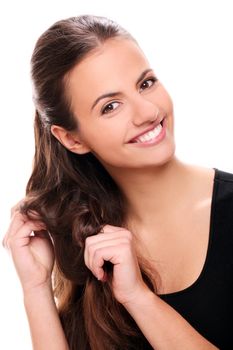Portrait of Attractive smiling woman touching her hair
