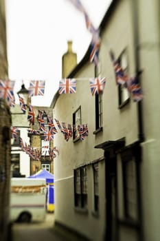 Alley with bazaar bunting in the form of the union jack flag in Knaresborough, England