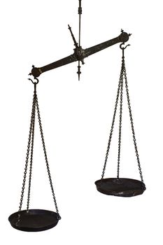 Set of hanging balance scales in black metal with a pointer to show once the pans are in equilibrium and the weights in each are equal