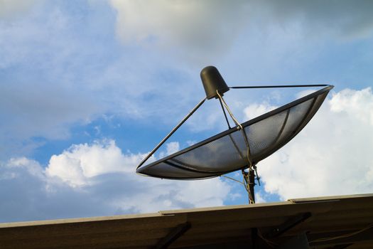 the satelite dish of cable tv for home use on the roof of building