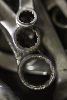 Closeup detail of three worn and well used metal spanners
