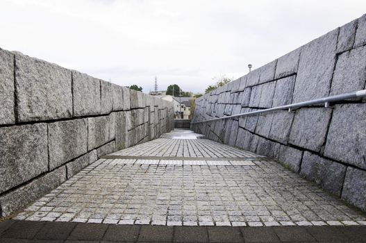 wall of rough granite blocks to arrive at Sayamaike Historical Museum,
Osaka, Japan 