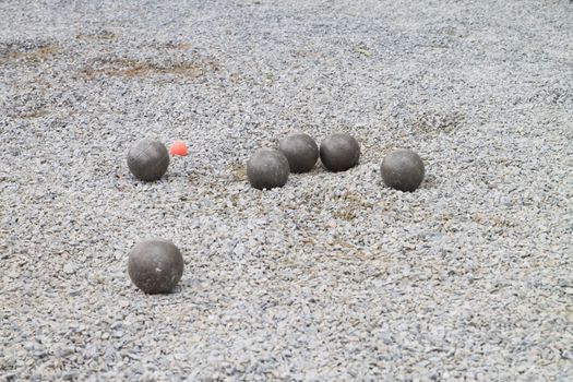Playing Petanque with cochonnet orange color
