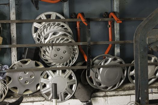 A selection of various wheel hubs stored in rack