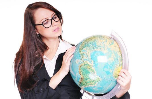 Pretty young teacher with globe over white background