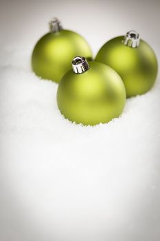 Beautiful Matt Green Christmas Ornaments on Snow Flakes Room For Your Own Text.