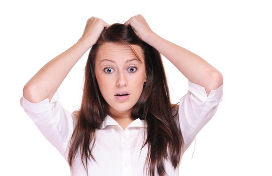 A shocked woman with her hands in her hair on a white background.