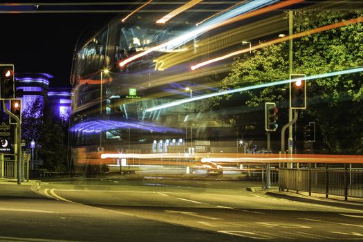 Long exposure night city scene of a street with light trails, captured from the passing vehicles