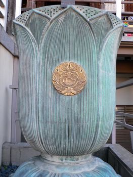 buddhist symbol of lotus flower on the religios water cup near temple, Kawagoe Japan
