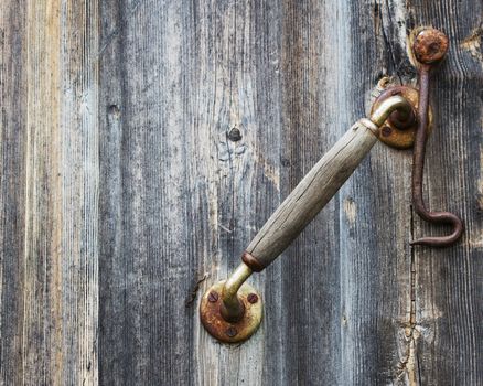Vintage door knob close up.  Wooden texture