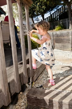 Walking around and playing in the garden on sunny spring day.