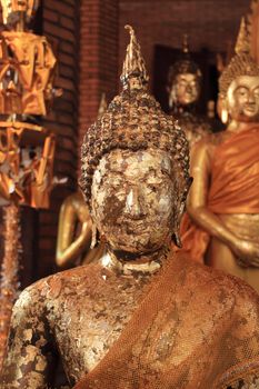 Buddha image covered with gold leaves at Wat Yai Chai Mongkhol, Ayutthaya, Thailand