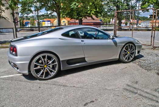 the ferrari 360 is a 2 seater sports car built by ferrari from 1999 to 2005, it succeeded the ferrari f355 and was replaced by the ferrari f430, it is a mid-engined, rear wheel drive v8-powered coupe, image is shot in July 2012 at halden station