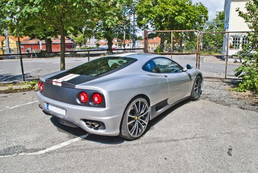 the ferrari 360 is a 2 seater sports car built by ferrari from 1999 to 2005, it succeeded the ferrari f355 and was replaced by the ferrari f430, it is a mid-engined, rear wheel drive v8-powered coupe, image is shot in July 2012 at halden station