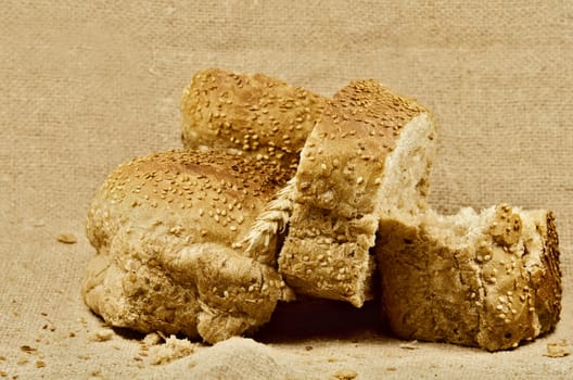 pieces of bread on burlap background
