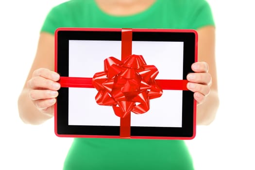 Tablet computer gift. Woman showing Digital touch screen tablet PC with gift ribbon. Closeup of woman giving tablet PC as christmas present.