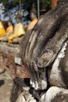 Close-up hand of Buddha statue at Wat Yai Chai Mongkhol, Ayutthaya, Thailand