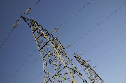 High Electricity Pylons with a Blue Sky