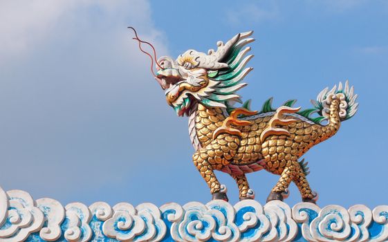 Dragon horse statue with cloud and blue sky in chinese temple, Thailand
