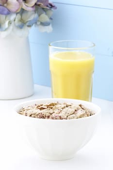 Delicious and healthy breakfast cereal with orange juice