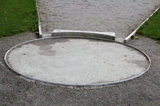 Shot put circle with stopboard close up.