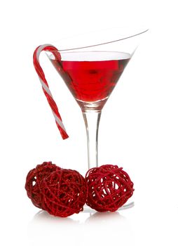 christmas cheer - colorful cocktail with candy cane on the side isolated on white background