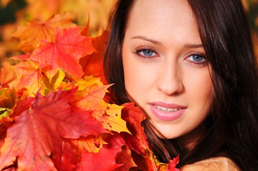 Beautiful elegant woman in autumn park