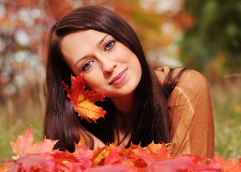Beautiful elegant woman in autumn park