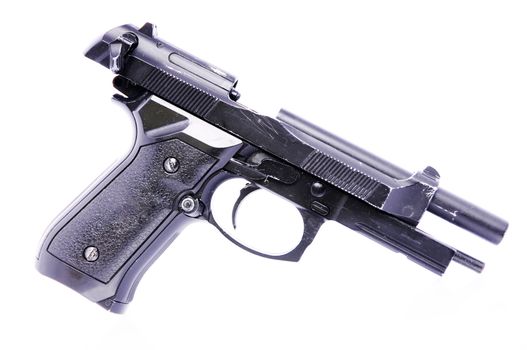 Modern U.S. Army handgun M9 close-up on a white background.