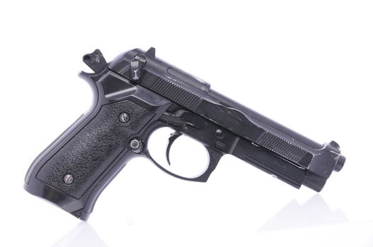 Modern U.S. Army handgun M9 close-up on a white background.