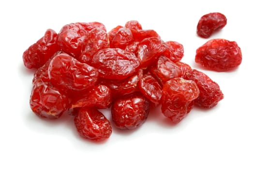 A handful of dried berries of dogwood on white background