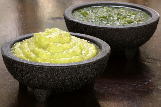perfectly made mexican guacamole,prepared with fresh avocados lemo juice vinegar and hot and sweet peppers   