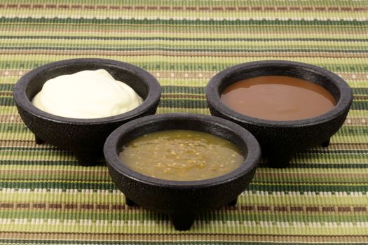 delicious sour cream, salsa verde and roja or tomatillo sauce made with hot peppers and fresh tomatillos   