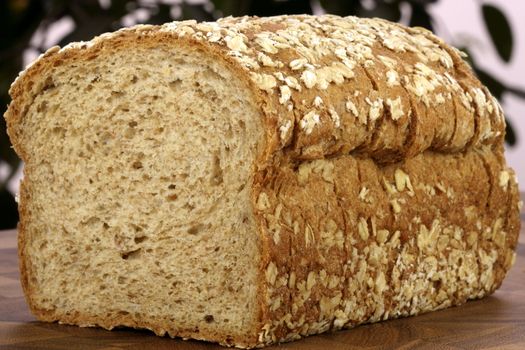 fresh baked  whole grain bread with oats pine nuts and lots of assorted healthy grains 