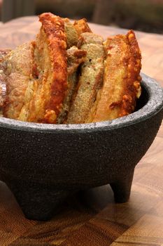 fried delicious mexican chicharron carnudo or fried mexican  pork skin with atached meat  exquisite famous mexican plate or snack