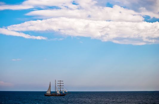 Old sailing ship in the sea .