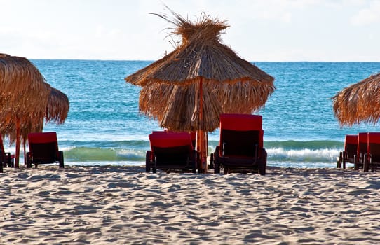 View of the beach with loungers and umbrellas.