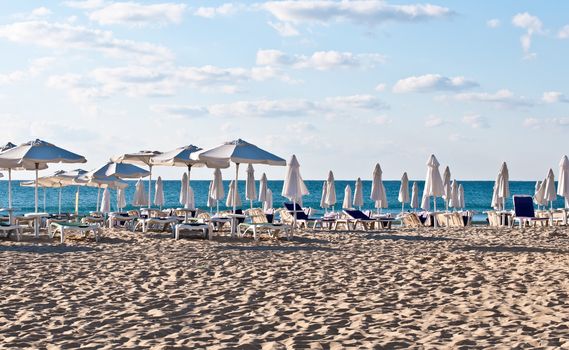 View of the beach with loungers and umbrellas.