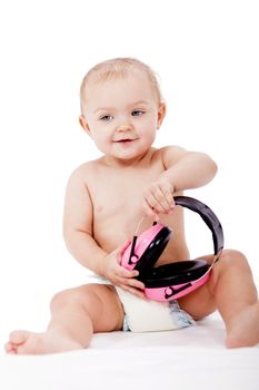 cute little baby with protection earphones isolated on white