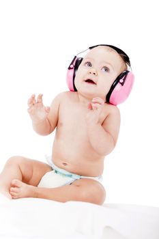 cute little baby with protection earphones isolated on white