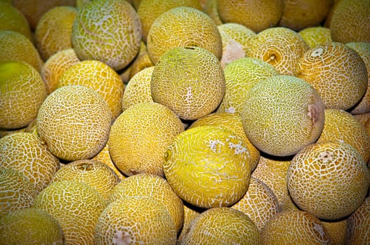 Selling melons on the market , background.