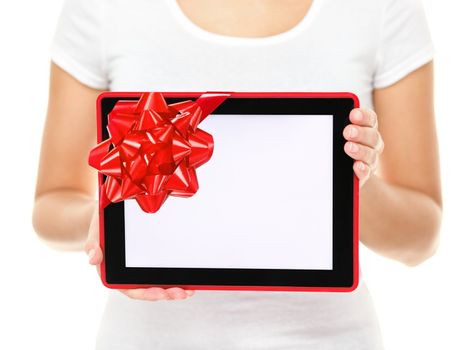Tablet computer screen gift. Closeup of touch pad tablet computer screen with red gift ribbon. Christmas gift or present isolated on white background.