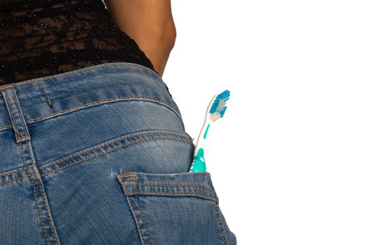 A toothbrtush in a jeans pocket