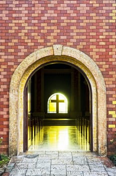 Heavy arch entrace of an ecumenical church